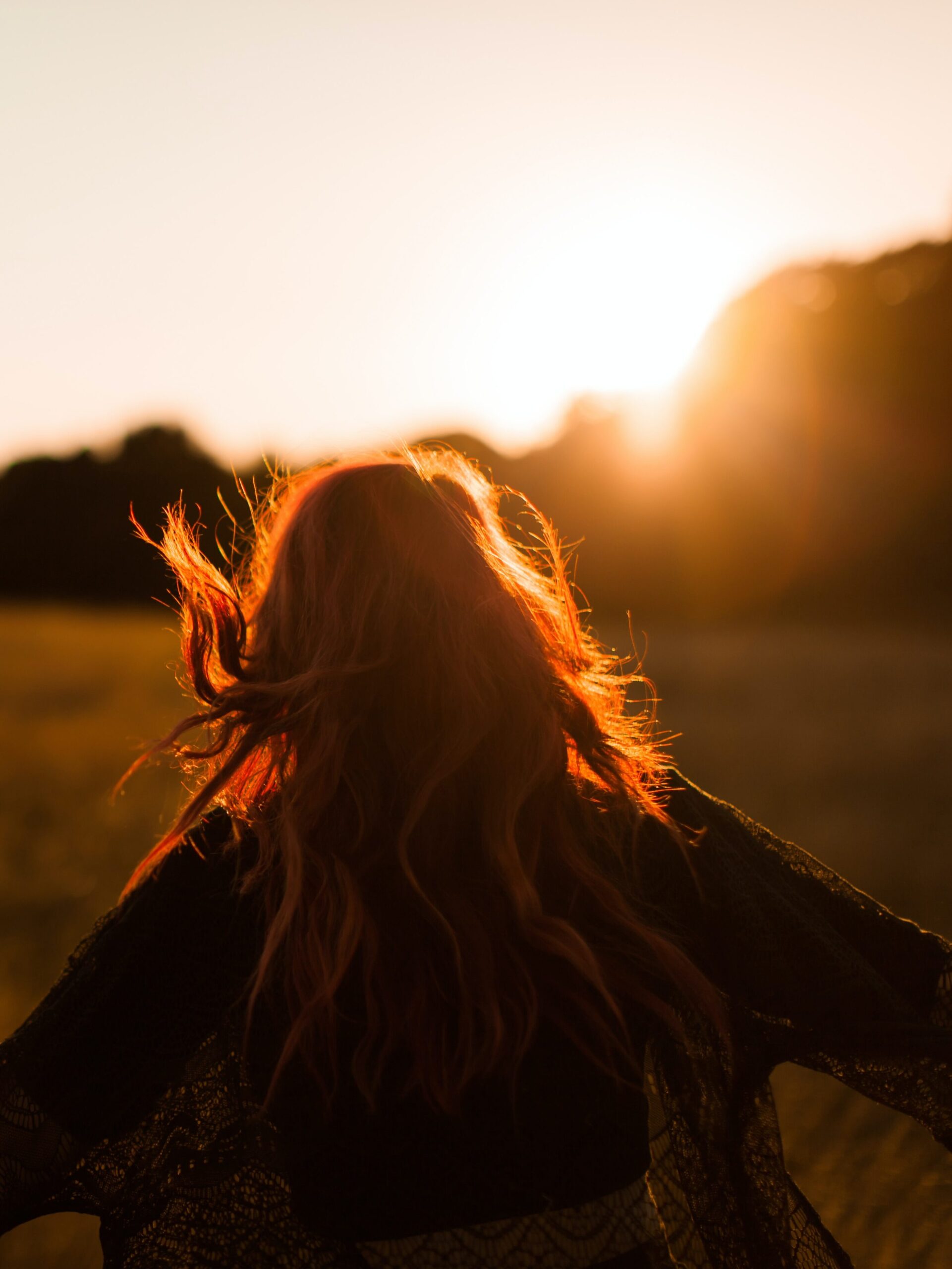 Girl running to sunset